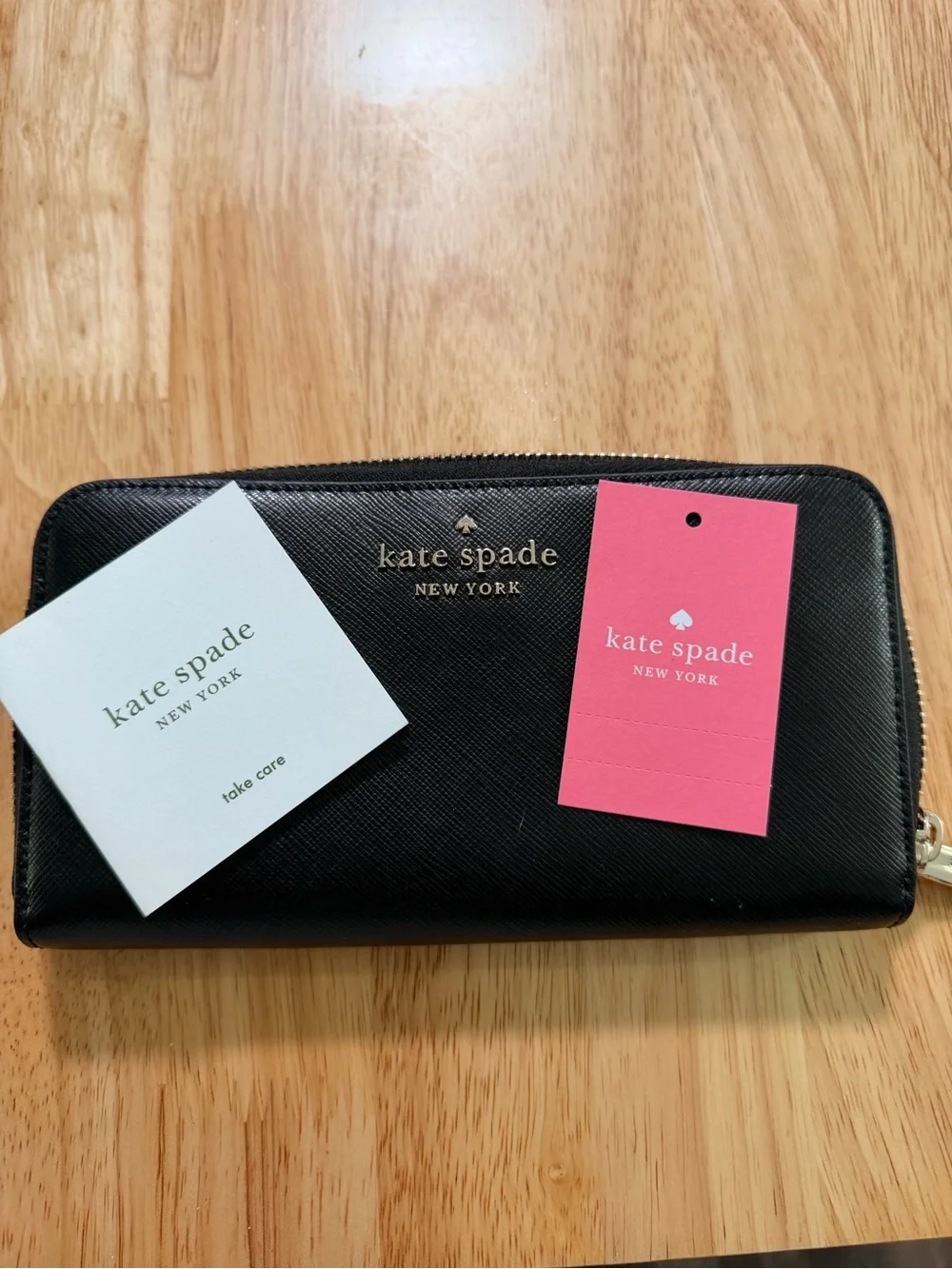 kate spade Black Saffiano Zip Around Wallet with Gold Logo